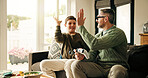 Father, child and high five for video game in home, win competition or parent bonding with son. Console, happy kid and dad with hands together for success, teamwork and family celebration in lounge