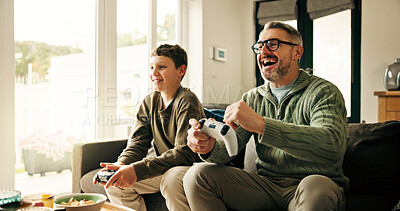 Buy stock photo Father, child and play video game with celebration, win competition and parent with son in home. Happy kid, dad and success with console with fist pump, happiness and bonding together with family