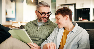 Buy stock photo Home, father and son on sofa, tablet and bonding together with online game, relax and smile. Apartment, family and dad on couch, boy and parent with tech, social media and digital app with support