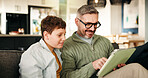 Home, father and son with tablet, smile and bonding together with online game, relax and support. Entertainment, family and dad on sofa, boy and parent with tech, social media and app with connection
