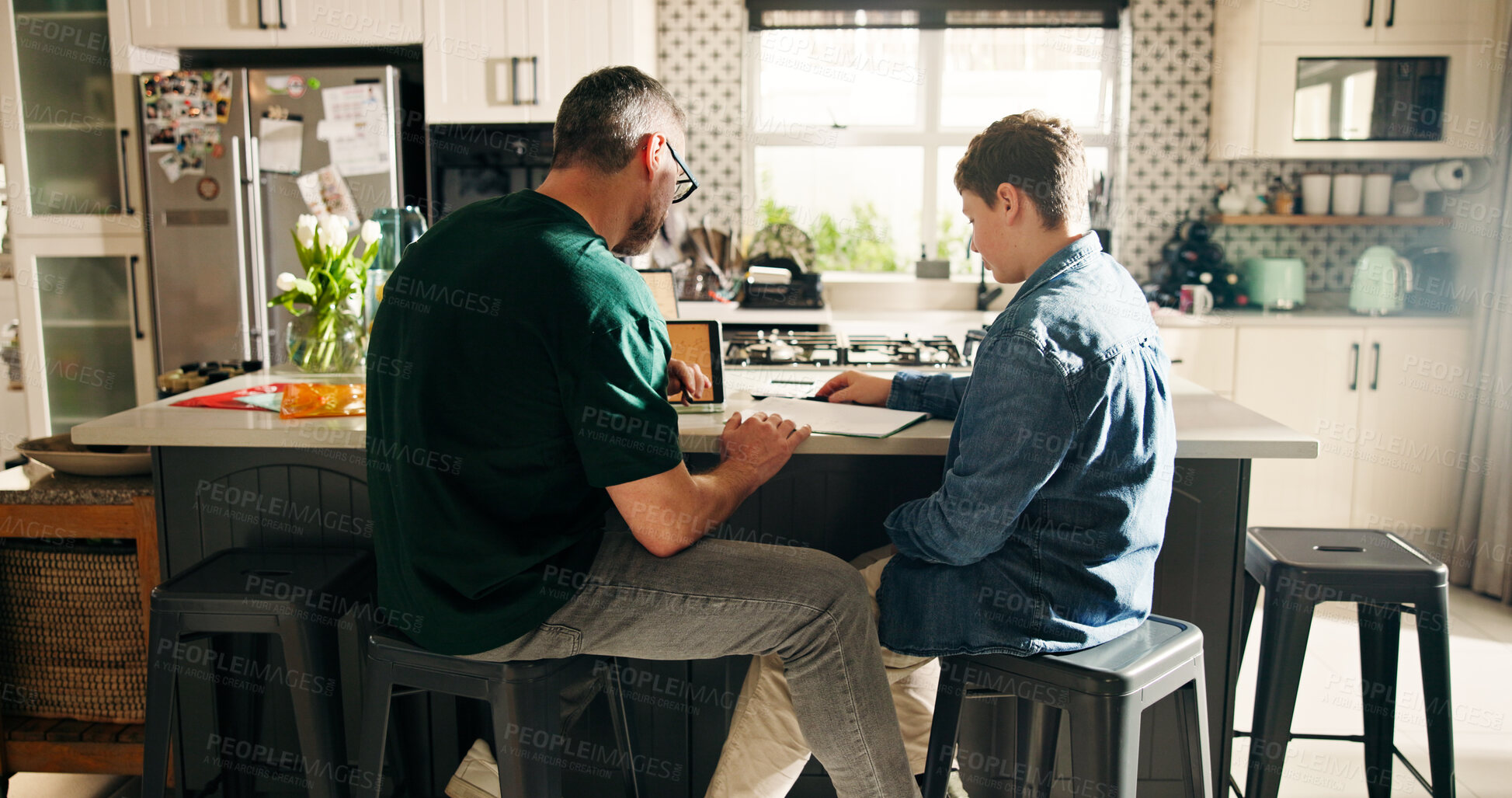 Buy stock photo Home, dad and child with notebook, education and help with math exam, growth or development for boy. Learning, student and man with kid in kitchen, family and preparing for test, knowledge and advice
