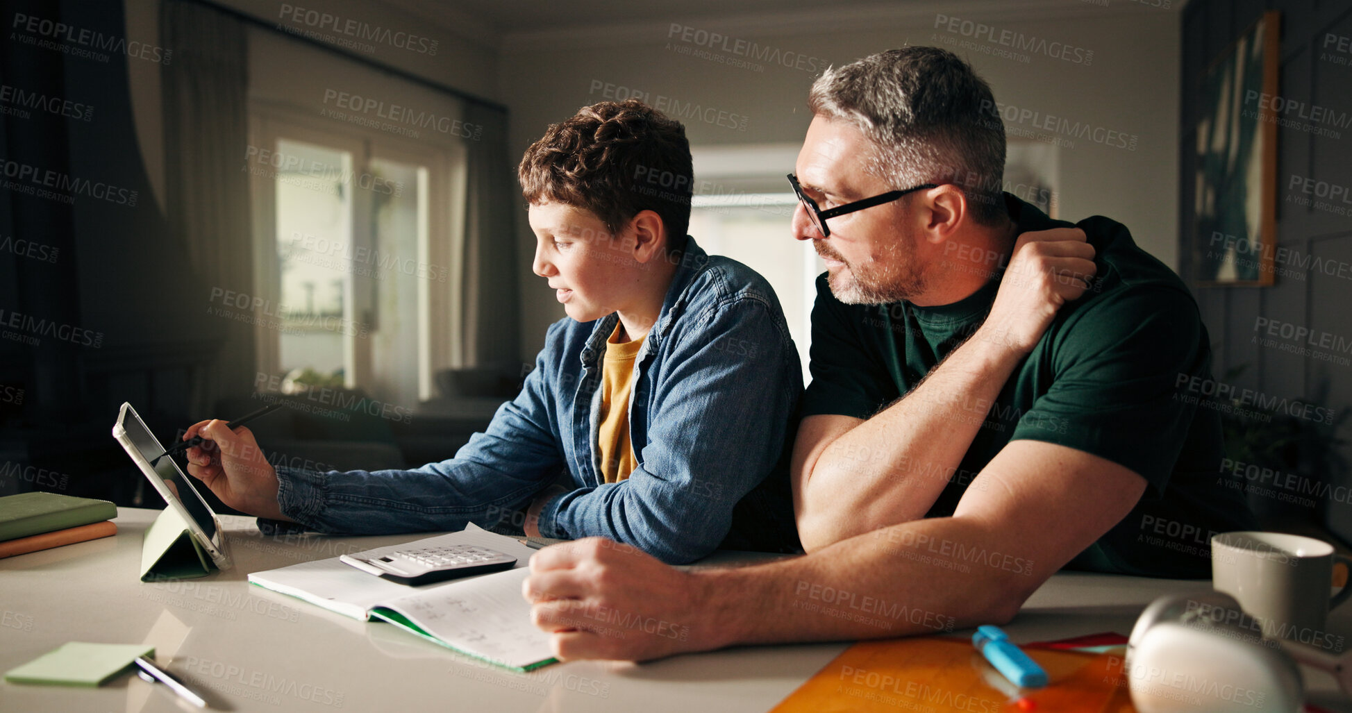 Buy stock photo Tablet, homework and help with father and son in kitchen for learning app, education or teaching. Growth, online school schedule and support with man and kid in family home for reading and math tutor