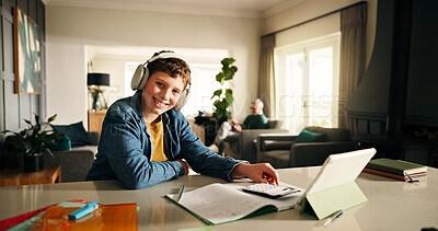 Buy stock photo Home, tablet and boy with headphones, studying and knowledge with book, sound and notes. Education, smile and child development with online course, calculator and elearning with audio for test