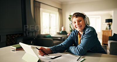 Buy stock photo Homework, tablet and student with headphones, portrait and elearning with book, calculator and smile. Boy, education and child development with online course, maths and studying with audio notes