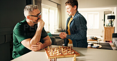 Buy stock photo Excited, chess and father with boy, home and family with competition, proud and winner. Apartment, parent and dad with happy son, game and victory with cognitive development, challenge and checkmate