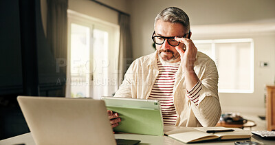 Buy stock photo Remote work, business man and tablet in home for company report, risk mitigation or compliance. Freelance financial analyst, mature person or tech for reading funding request or investment evaluation