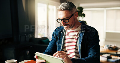Buy stock photo Business, man or tablet with reading in home office for article review, remote work or blog research. Freelance writer, mature person or technology at desk for publishing revision or planning chapter