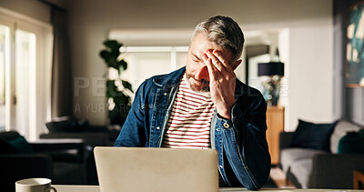 Buy stock photo Headache, remote work and man on laptop in home with stress for deadline, burnout and fatigue. Freelance, professional and person with strain, pressure and overworked for online project on computer
