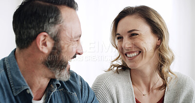 Buy stock photo Bonding, laughing and love with couple in home together for break, relax or wellness on weekend. Happy, moment and relationship with mature man and woman in apartment for comedy, funny joke or humor