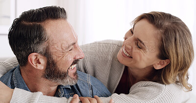 Buy stock photo Bonding, hug and laughing with couple in home together for break, relax or wellness on weekend. Embracing, happy and relationship with mature people in apartment for comedy, funny joke or humor