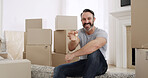 Happy man, portrait and keys with boxes in new home for property investment or mortgage loan. Excited, male person or homeowner with smile, access or packages for house purchase, sale or buy asset