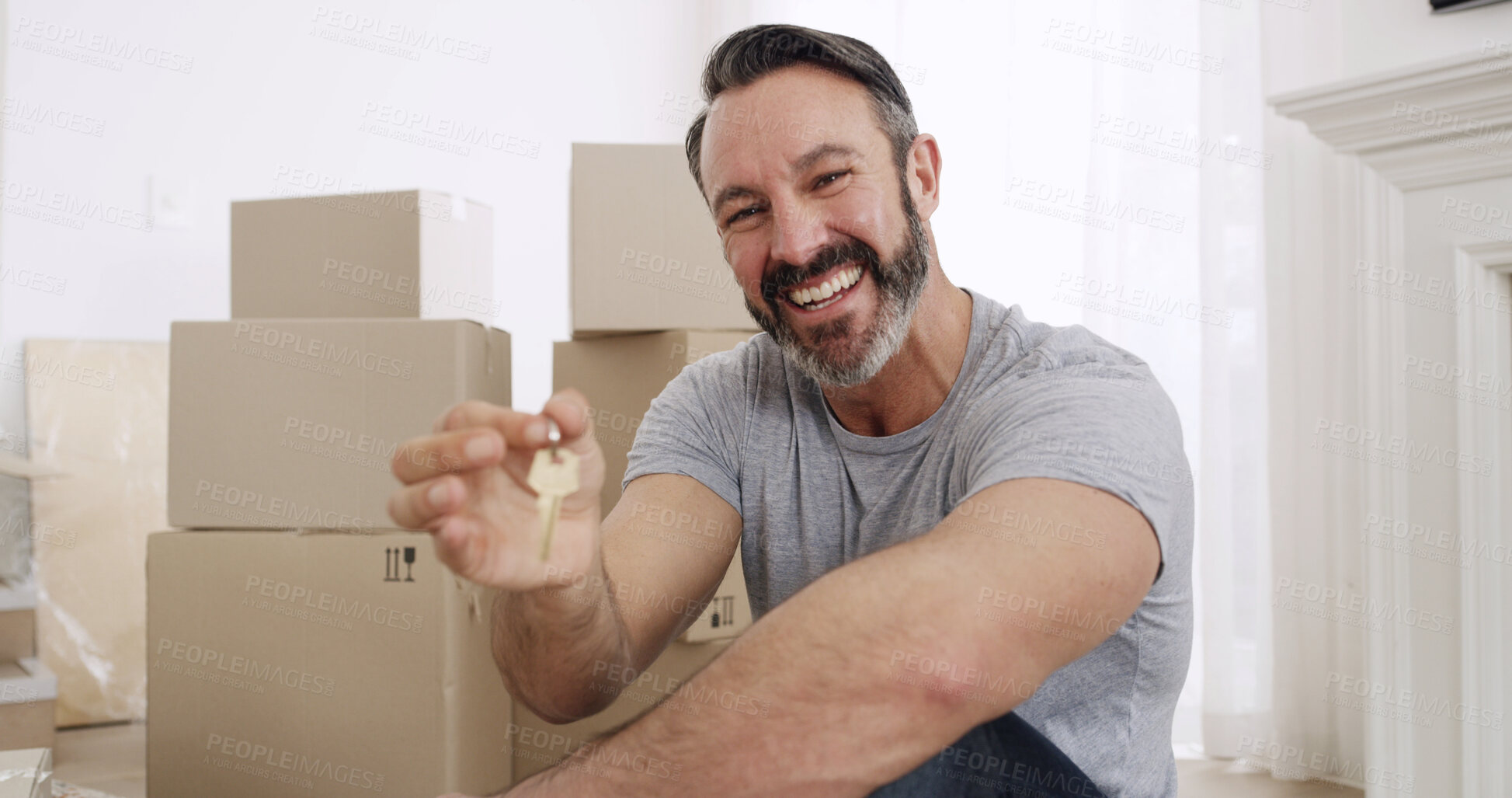 Buy stock photo Happy man, boxes and portrait with keys in property for investment, purchase or new home. Excited, male person or homeowner with smile, access or packages for fresh start, house or apartment sale