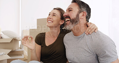 Buy stock photo Real estate, excited couple and keys in new home for mortgage success, relocation and moving in. Boxes, mature man and happy woman with hug for property purchase, goals or finance investment together