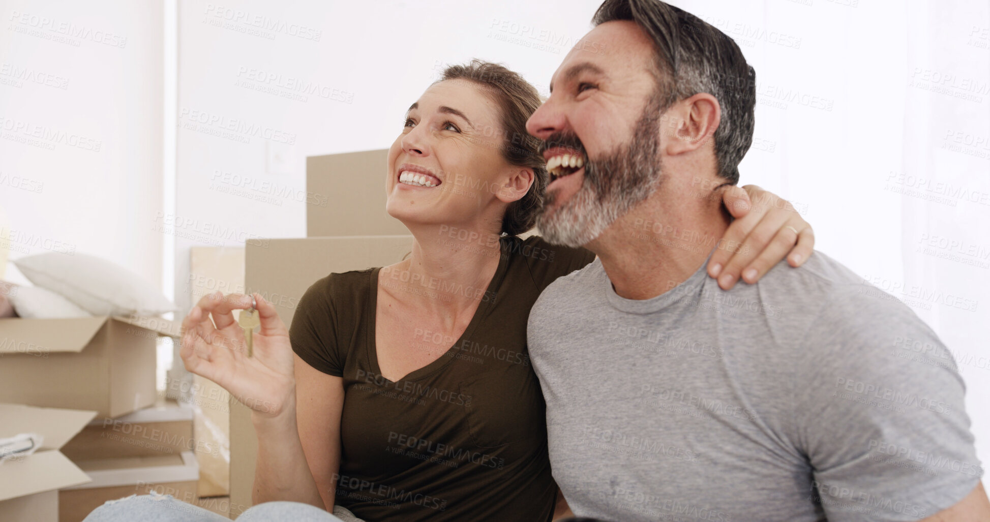 Buy stock photo Real estate, excited couple and keys in new home for mortgage success, relocation and moving in. Boxes, mature man and happy woman with hug for property purchase, goals or finance investment together