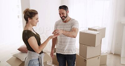 Buy stock photo Happy couple, moving in and handout key to new home for property ownership, investment and rent. Man, woman and giving access to real estate for relocation, mortgage and sale for fresh start together