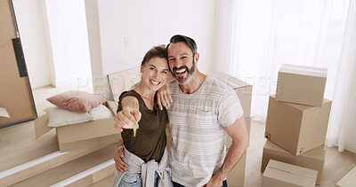 Buy stock photo Couple, portrait and happy with keys in new home for property purchase, moving in or ownership. Above, mature man and excited woman with hug in dream house for mortgage insurance, security or support