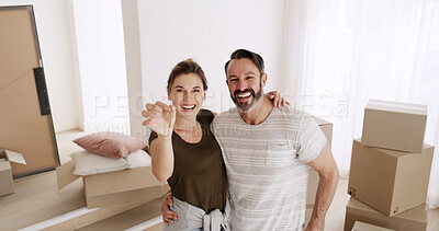 Buy stock photo Happy couple, portrait or hug with key in new home for mortgage success, moving in and ownership. Above, mature people or excited with property investment together for real estate security or support