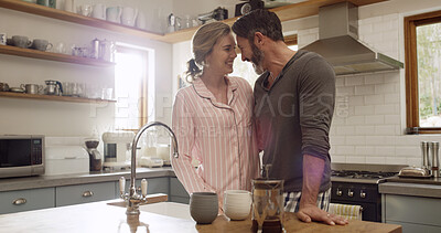 Buy stock photo Coffee, smile and love with couple in kitchen for morning, commitment and beverage mug. Happiness, support and drink with man and woman bonding in home for connection, marriage and break together