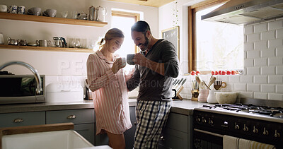 Buy stock photo Cheers, smile and couple with coffee in kitchen for bonding, connection or conversation together. Toast, drinking and man with woman for morning, caffeine beverage and communication or chat in home