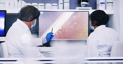 Buy stock photo Lab, scientists and people with monitor, pointing and collaboration for project or medical research. Back, biology and team with computer for cell analysis, screen and conversation for innovation