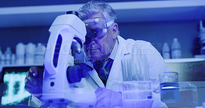 Buy stock photo Man, scientist and check with microscope in lab for research, medical experiment and testing dna. Mature person, goggles and sample with neon light, genetic engineering and studying virus for biotech