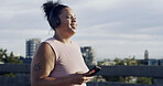 Music, fitness and woman with mobile in city for streaming sound, podcast to listen to radio. Cellphone, smile or African runner with headphones for cardio, audio or exercise break outdoor with space