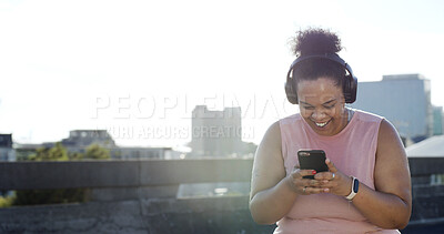Buy stock photo Headphones, fitness and happy woman with mobile in city for audio, space or motivation playlist. Sports, phone and plus size person outdoor with radio online, exercise music or weight loss results