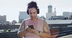 Headphones, fitness and woman with phone in city for audio, podcast or motivation playlist. Sports, mobile and plus size person outdoor with radio, streaming online or exercise music for weight loss