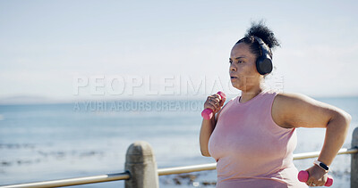 Buy stock photo Exercise, headphones and woman by beach with music, podcast or running for fitness. Sports, audio and plus size athlete to lose weight with radio, cardio and workout or training outdoor by promenade
