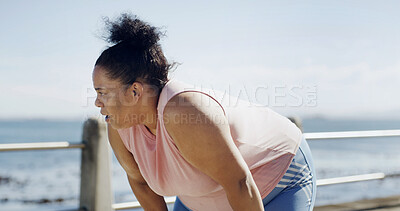 Buy stock photo Fitness, woman and tired runner by ocean for health, wellness and workout recovery at promenade. Fatigue, sports and plus size person rest outdoor, breathing and exhausted from cardio with space