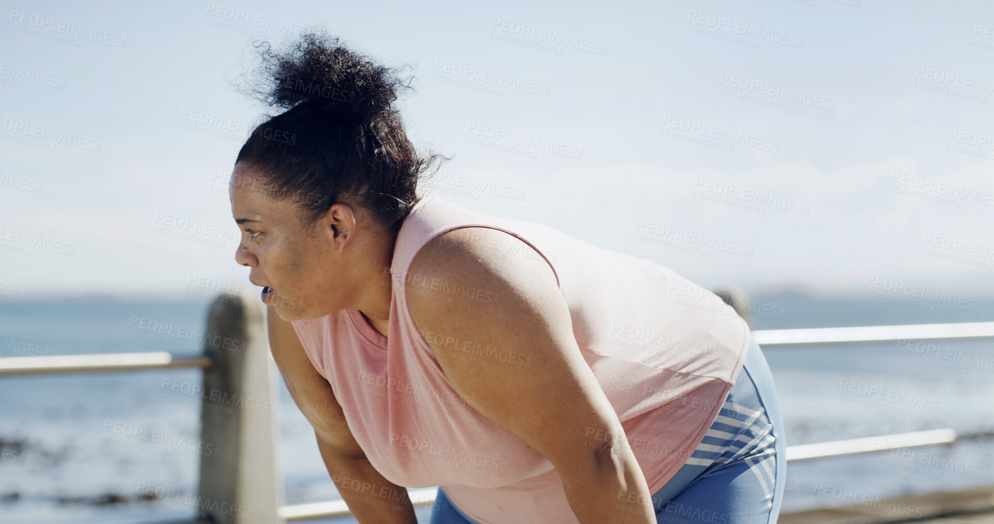 Buy stock photo Fitness, woman and tired runner by ocean for health, wellness and workout recovery at promenade. Fatigue, sports and plus size person rest outdoor, breathing and exhausted from cardio with space