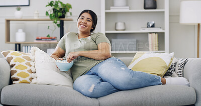 Buy stock photo Happy woman, couch and relax with popcorn in home for portrait, streaming or movie binge on weekend. Snack, eating and plus size person on sofa for entertainment, watching tv or break in living room