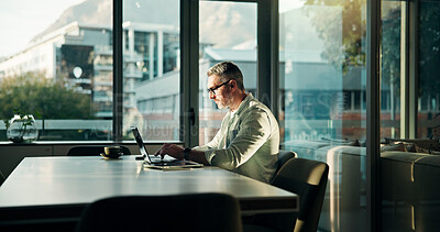 Buy stock photo Businessman, office and typing with laptop for journalism, online story or company report. Mature, man or journalist with computer for manuscript revision, blog submission and publication at agency