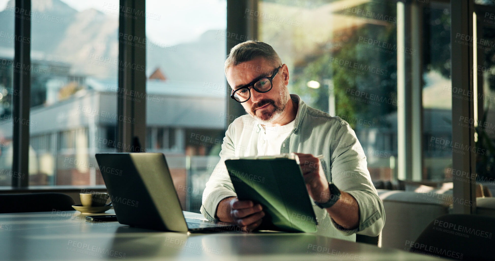 Buy stock photo Office, tablet and business man on laptop for research, online report and budget planning. Professional, startup manager and mature person on tech for company review, proposal and project management