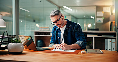 Buy stock photo Writing, laptop and documents with business man in office for budget research, planning or graph. Profit chart, account review and paperwork with mature person for finance, revenue balance and growth