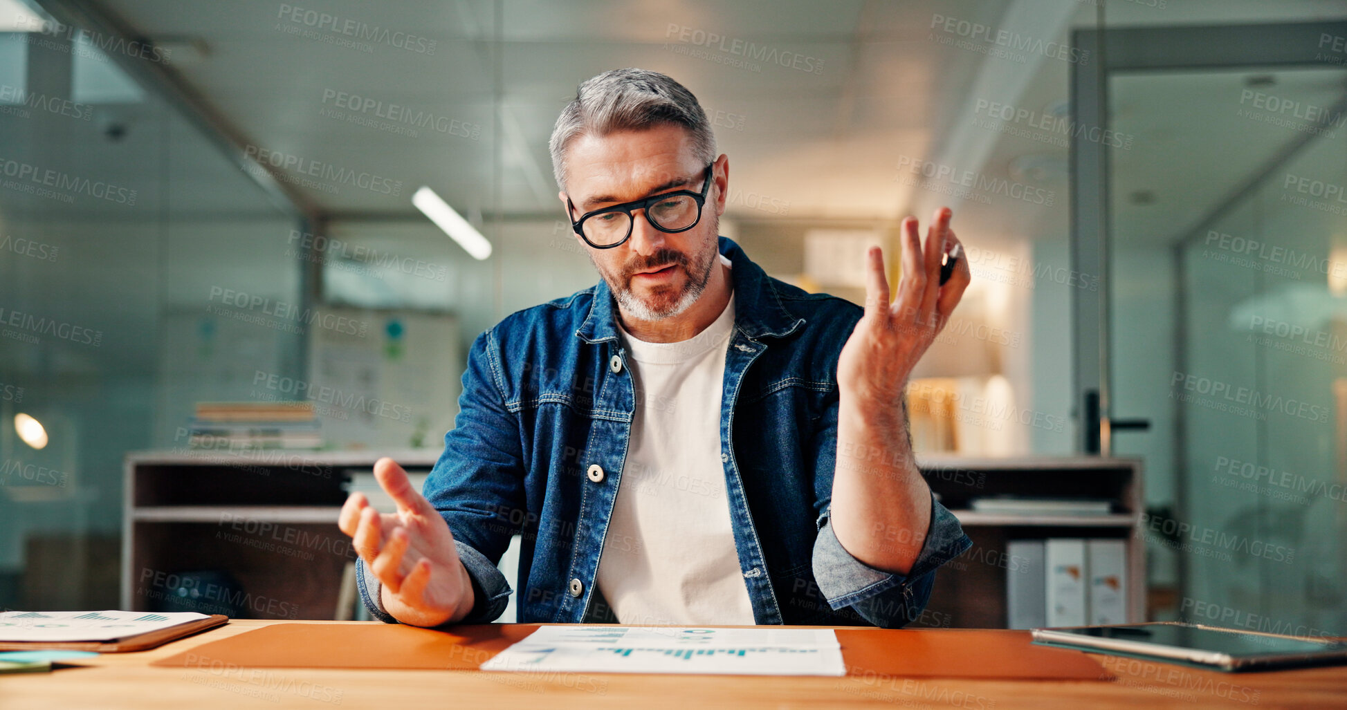 Buy stock photo Documents, problem solving and reading with business man at desk in office for financial review. Data, finance and report with employee in workplace for evening evaluation of charts or graphs
