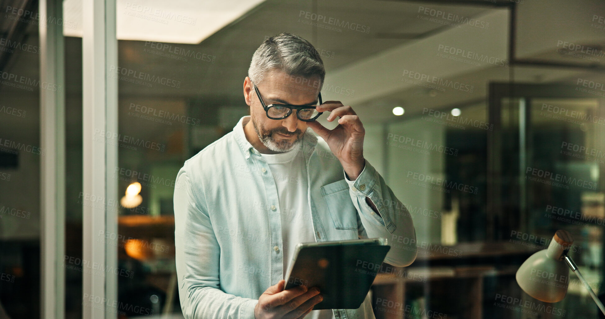 Buy stock photo Glasses, office and business man on tablet for finance review, online trading and investment news. Reading, mature and person on digital tech for financial report, budget planning and fintech website