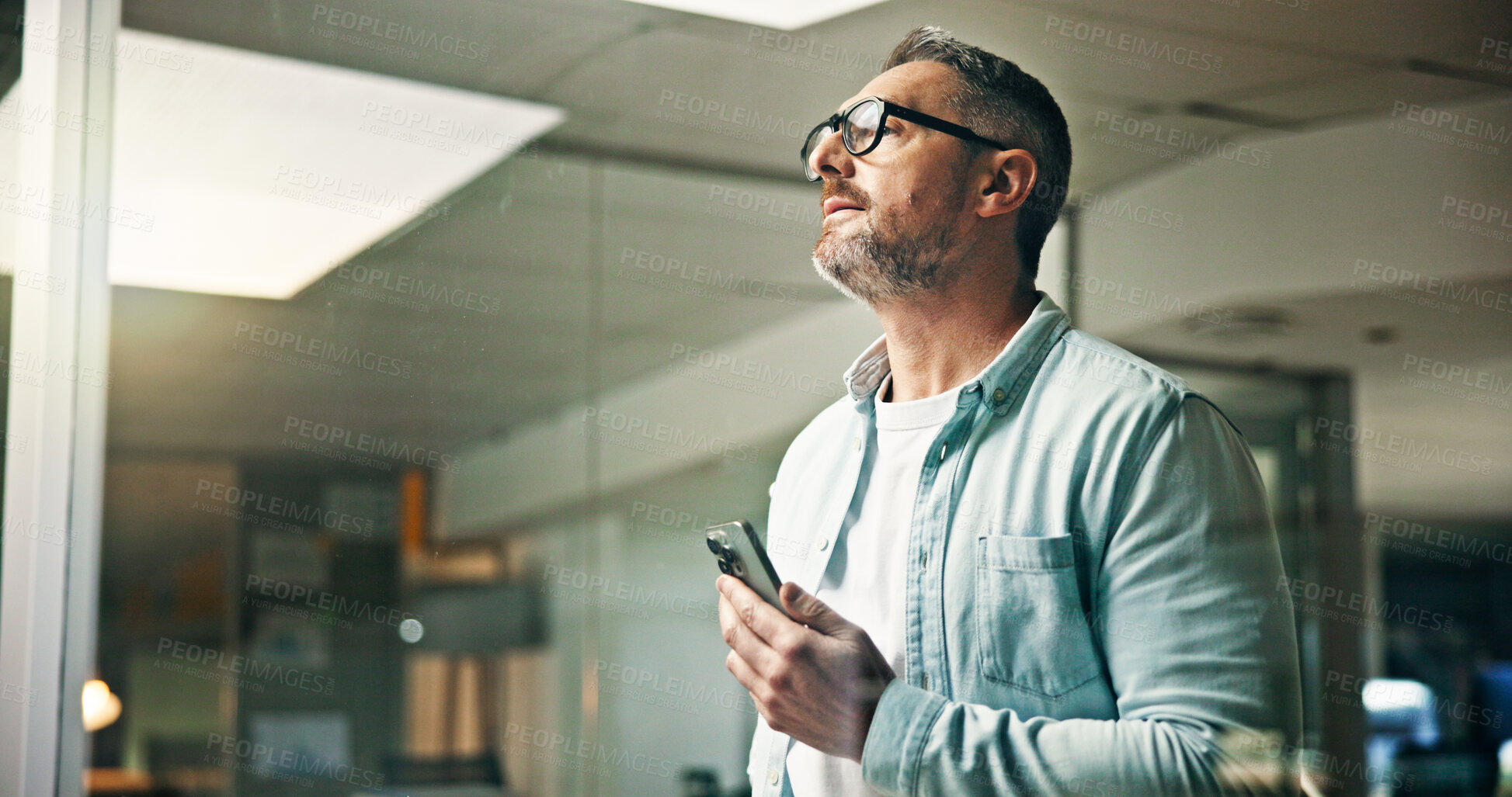 Buy stock photo Business, thinking and man in office, smartphone and problem solving with creative agency. Mature person, brand manager or employee in workplace, cellphone and decision with ideas, planning or choice