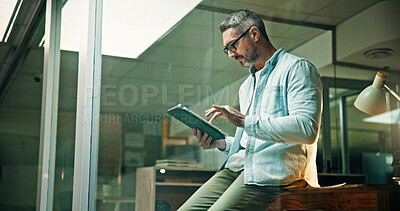 Buy stock photo Night, office and mature businessman on tablet for finance review, online trading and investment news. Typing, scroll and person on digital tech for financial report, budget planning and website