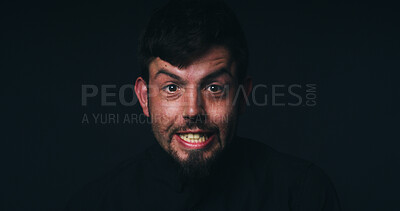 Buy stock photo Anger, crisis and portrait of man in studio for psychology, panic and schizophrenia symptoms. Fear, frustrated and mockup space with face of person with bipolar disorder on black background for rage