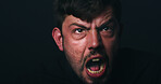 Angry, bipolar and man screaming in studio with schizophrenia, paranoid and panic reaction. Male person, shout and mental health crisis, split personality and rage of mockup space on black background