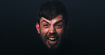 Anger, scream and portrait of man in studio for psychology, panic and schizophrenia symptoms. Fear, frustrated and mockup space with face of person with bipolar disorder on black background for rage
