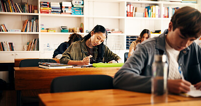 Buy stock photo Writing, education and girl in classroom for college admission tests, thinking and quiz. Aptitude assessment, knowledge and academy with teenage students in high school for lesson or scholarship exam