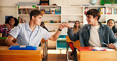 Buy stock photo Smile, friends and fist bump in high school for education achievement, goal or support. Happy boys, celebration and teamwork in class with teen students for learning, pass exam or scholarship success