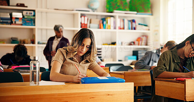 Buy stock photo High school students, girl and writing in classroom for exam assessment, quiz evaluation or learning. Teenager, teacher and people with aptitude test in lesson for scholarship or curriculum knowledge