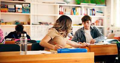 Buy stock photo Writing, education and student in classroom with notes for college admission tests, study and quiz. Aptitude assessment, knowledge and academy with girl in high school for lesson or scholarship exam