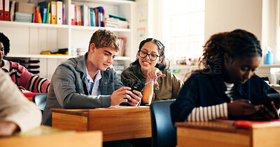 Buy stock photo Learning, students or friends with phone in classroom for research, online course or smile. Teenager, boy and girl with mobile for education assignment, scholarship or chat for high school curriculum