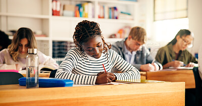 Buy stock photo High school students, girl and writing in lesson for assessment quiz, evaluation test or learning. Teenager, education and people with exam essay in classroom for scholarship or curriculum knowledge