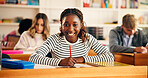Excited, writing and portrait of teenager in classroom for learning, education or development. Smile, books and face of girl with studying at high school for test, exam or assignment on campus.