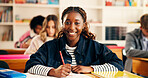 Happy, writing and portrait of teenager in classroom for learning, education or development. Smile, books and face of girl with studying at high school for test, exam or assignment on campus.